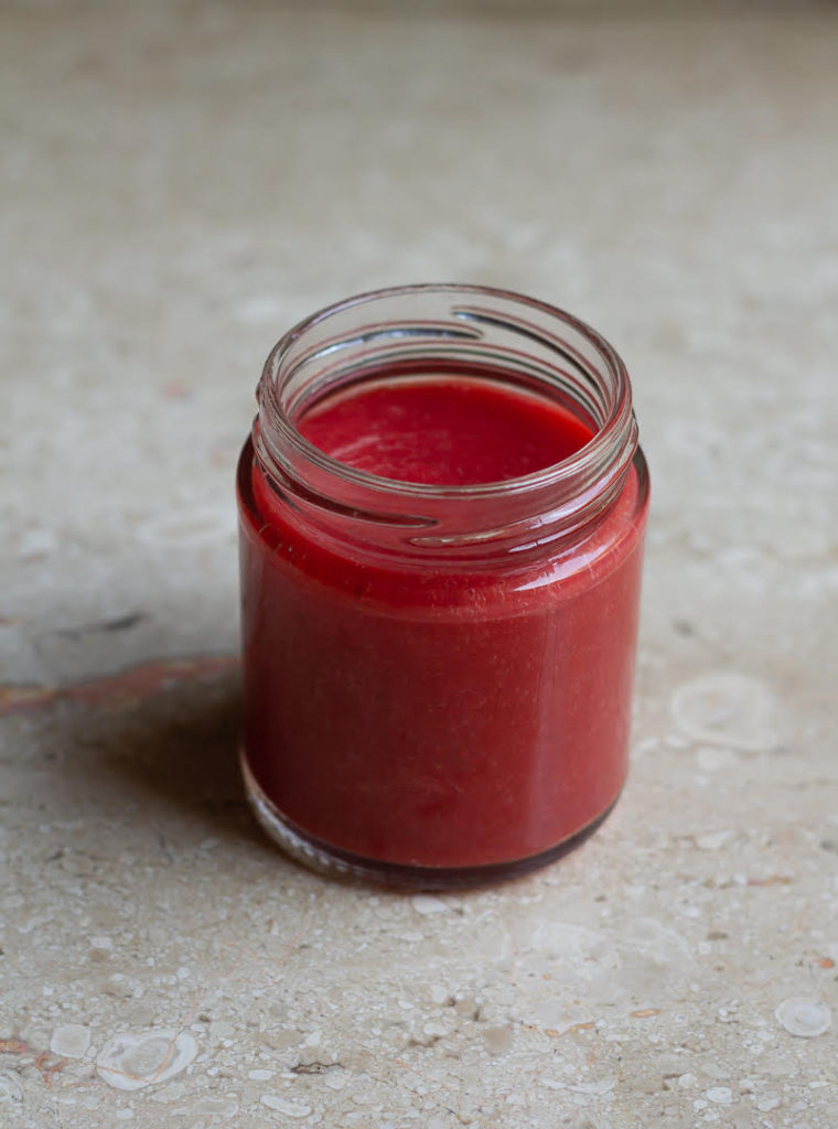 Fresh Strawberry Sauce in a glass jar.