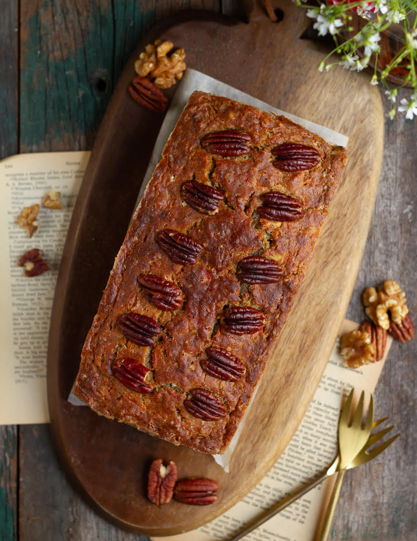 Banana Carrot Bread on a wooden board with 2 forks on the side.