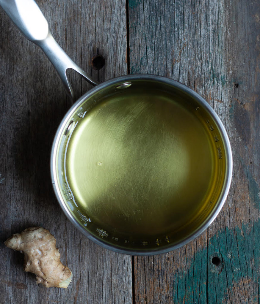 oil in a saucepan and a knob of ginger on the side.