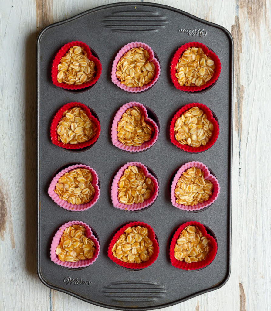 Making the oats base in silicon mold in a mini muffin pan