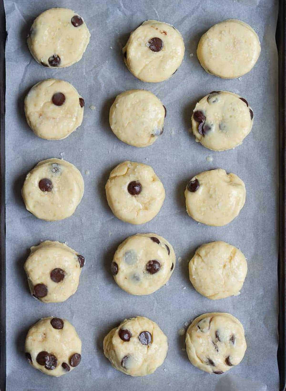 ready to bake scones on parchment paper.