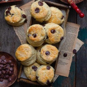 Chocolate chip scones on a wooden tray.