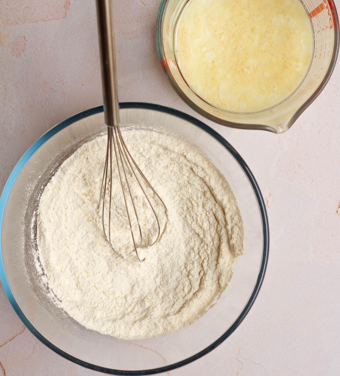 Dry and wet ingredients in mixing bowls.