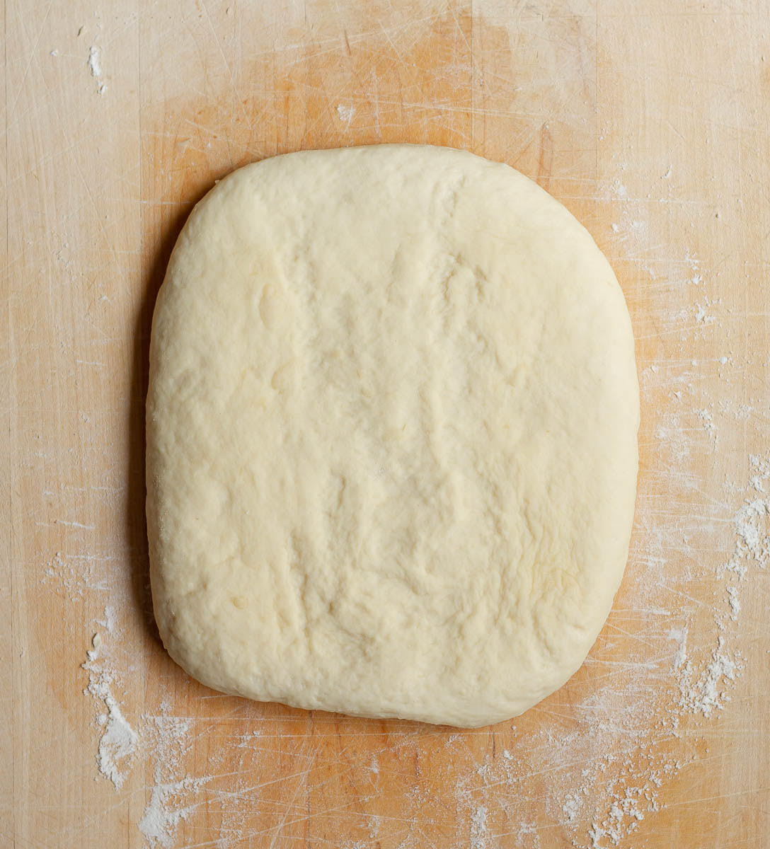 Dough for Monkey Bread on a wooden board.