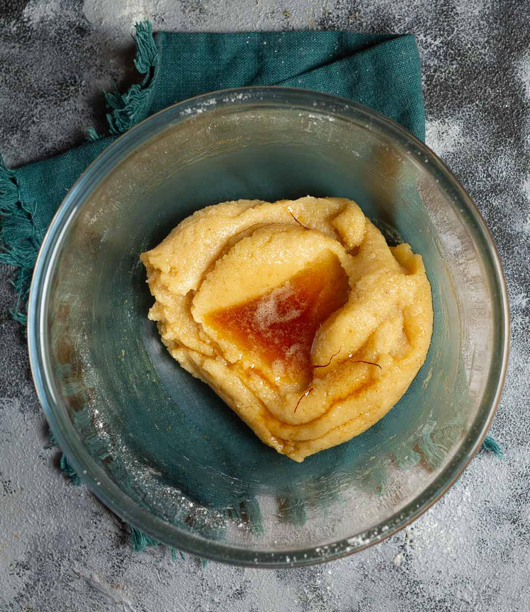 Whisk the saffron infused browned butter in the batter