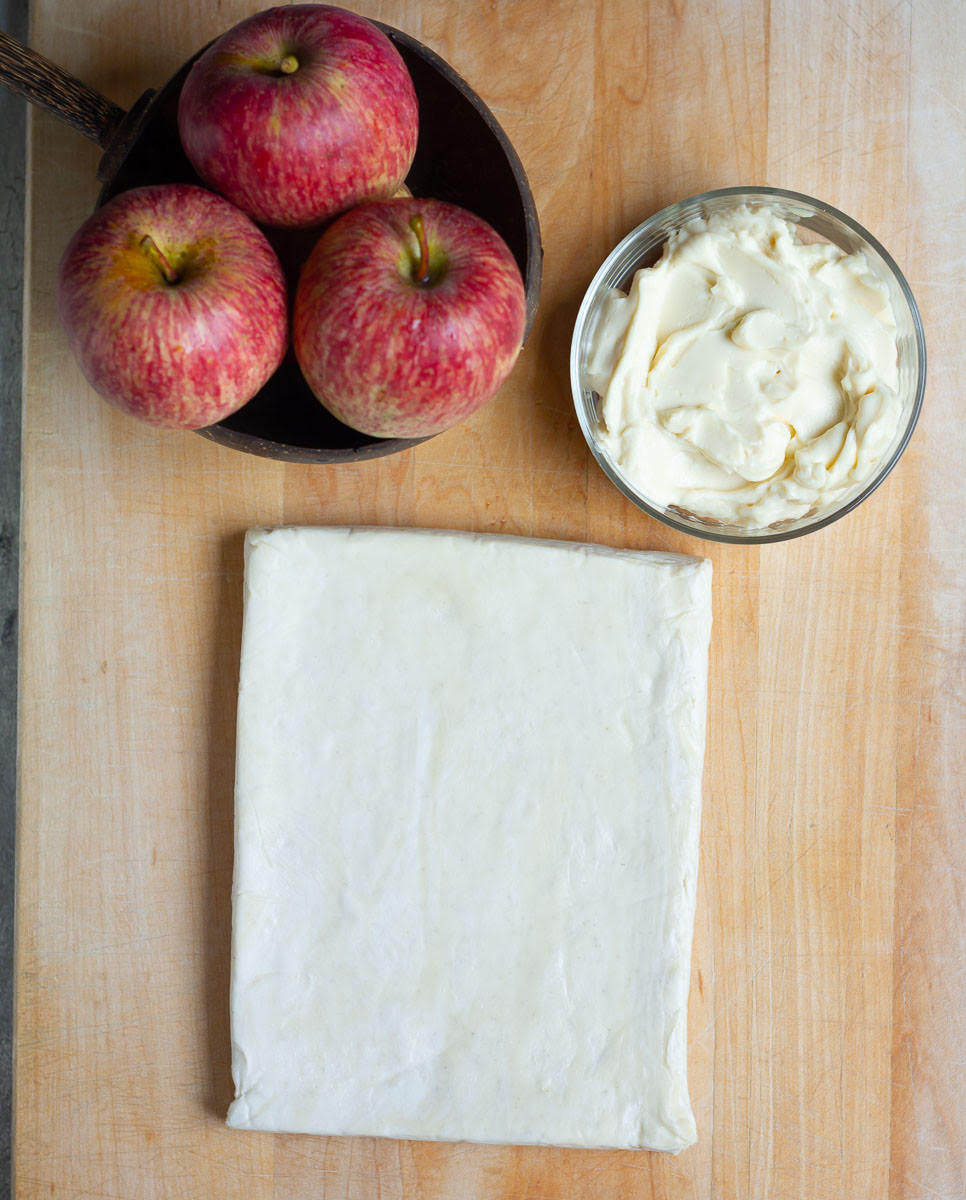 Ingredients for making apple puff pastry tart.