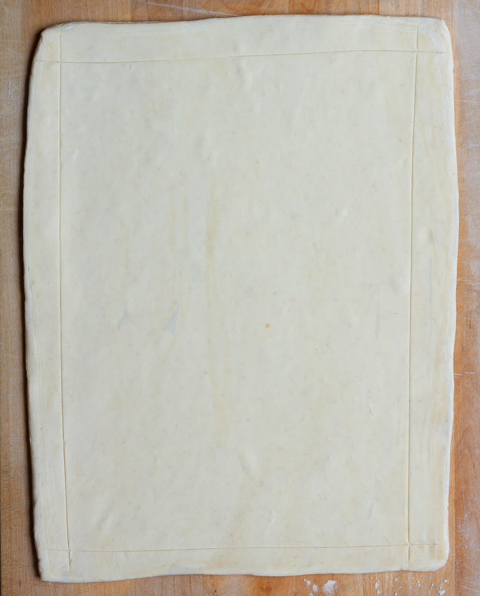 Rolled out pastry scored along the edges.
