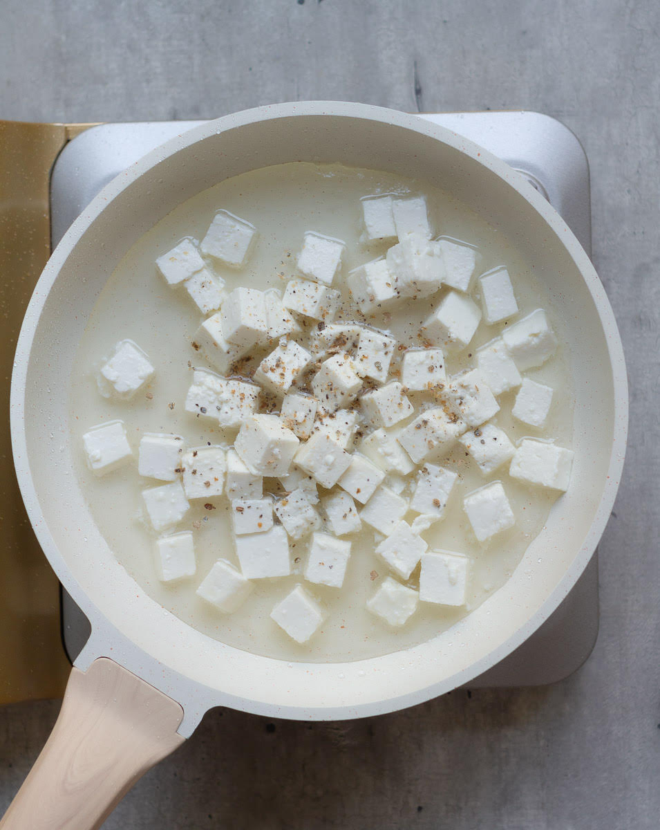 Add paneer cubes and cardamom powder