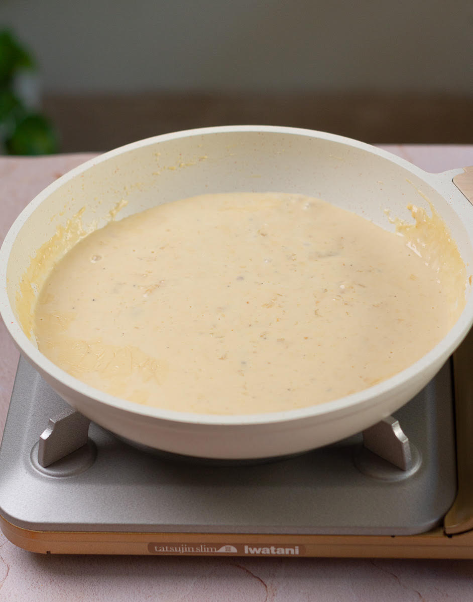 Cook milk and cardamom powder until thick