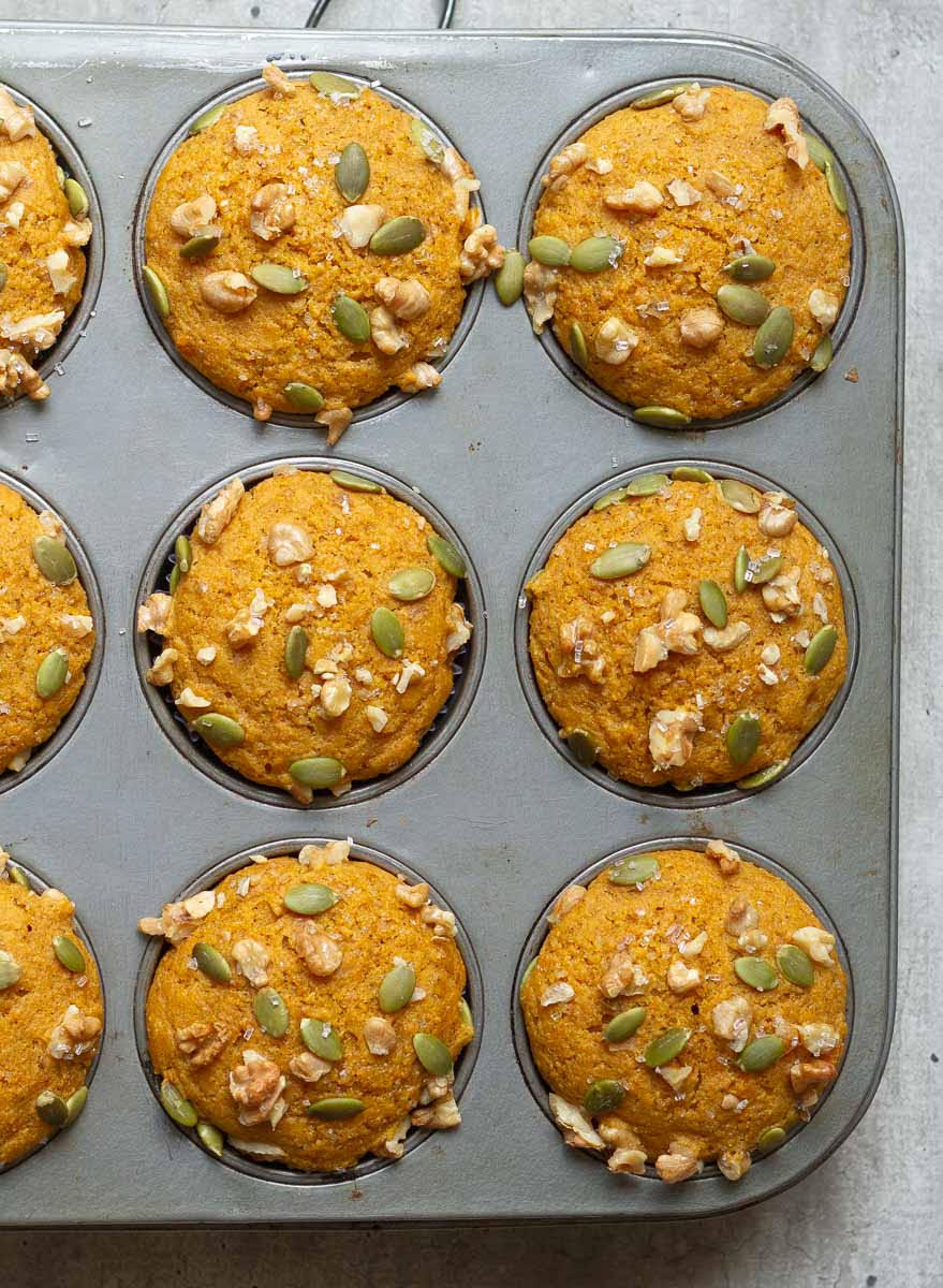 Baked pumpkin muffins in a muffin tray.