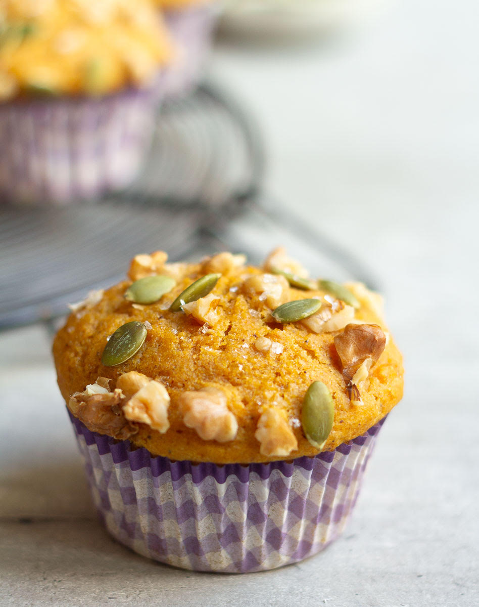 A pumpkin muffin with toppings.