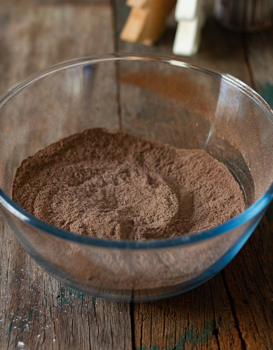 Dry ingredients for crinkle cookies in a mixing bowl.