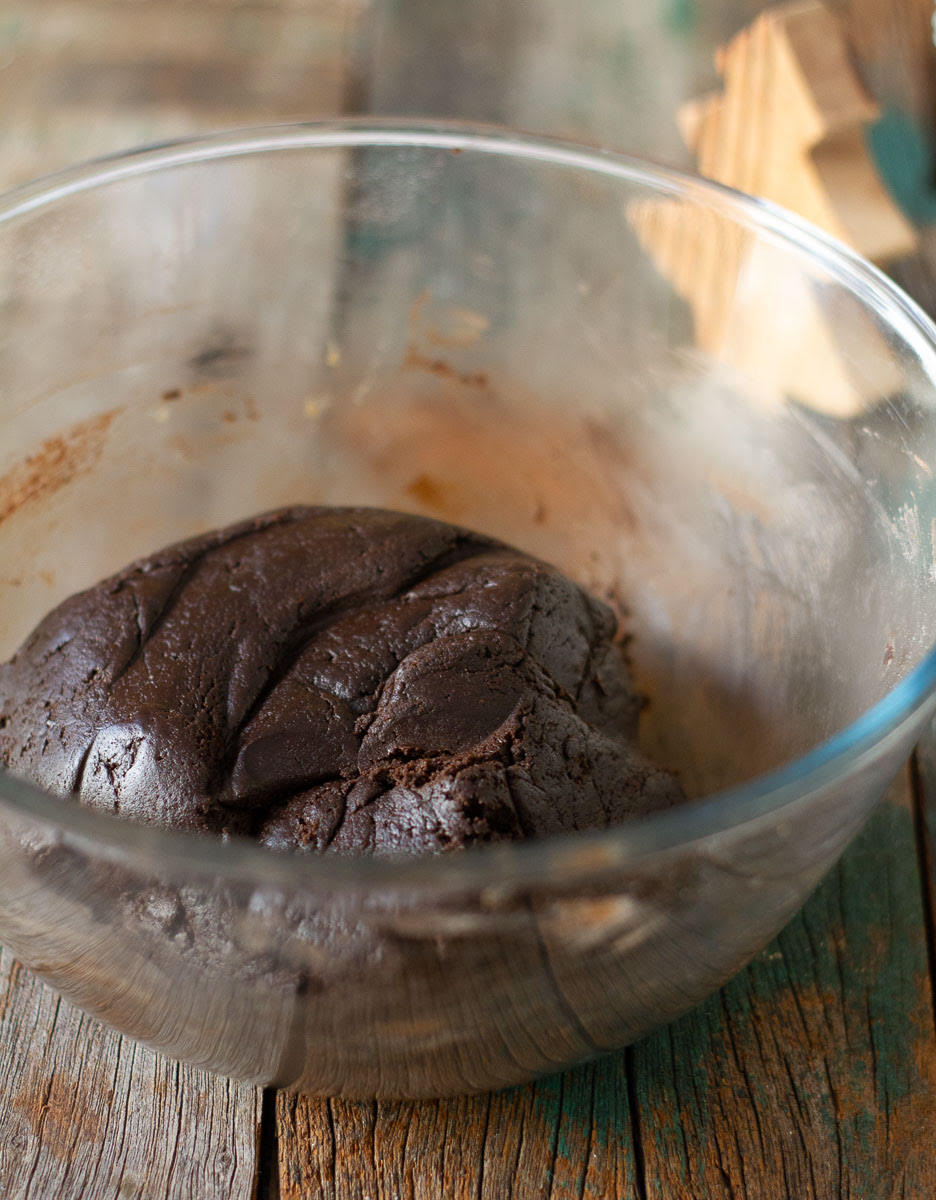 Chocolate cookie dough in a mixing bowl.
