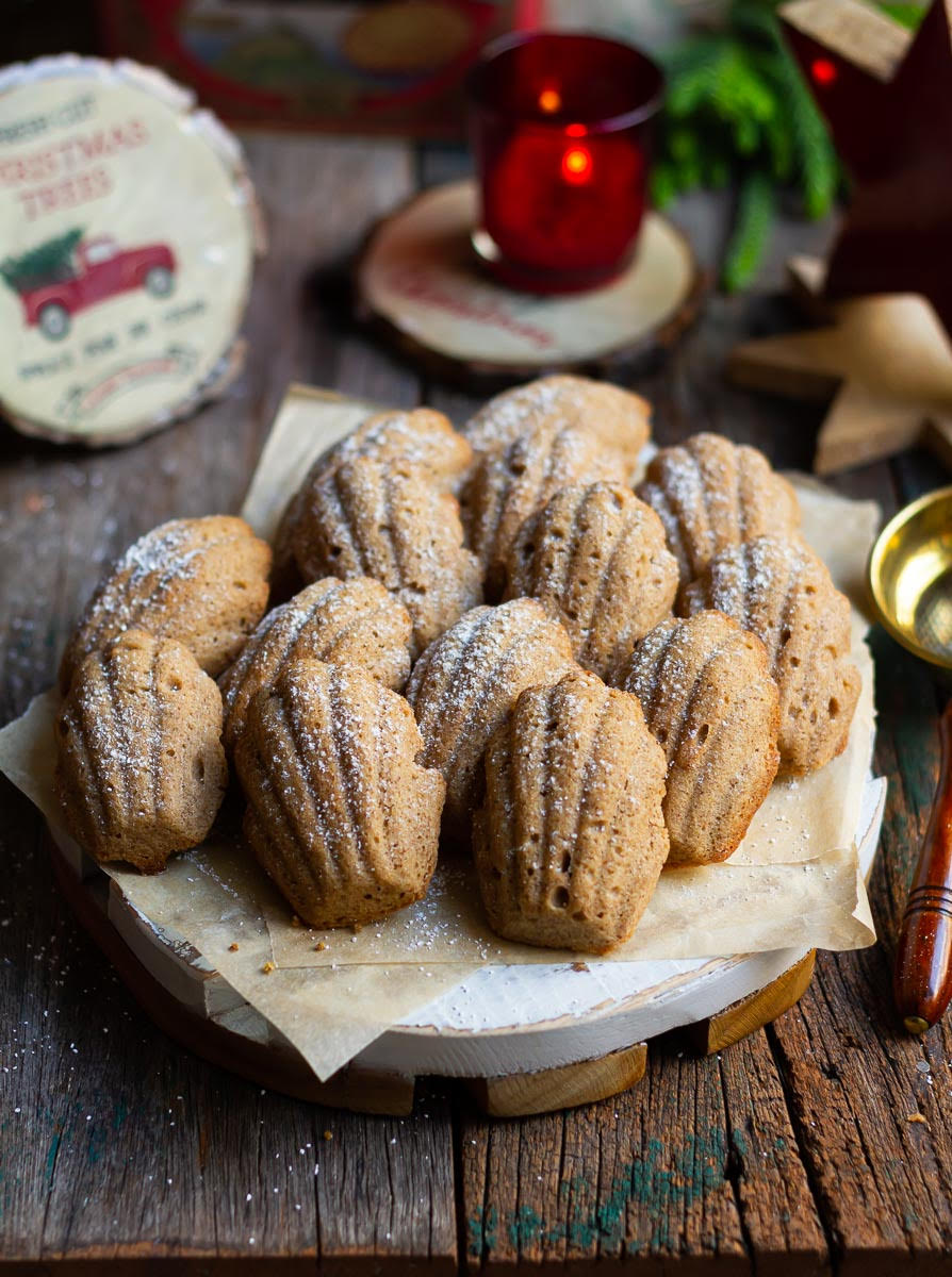 gingerbread madeleines on a wooden board.