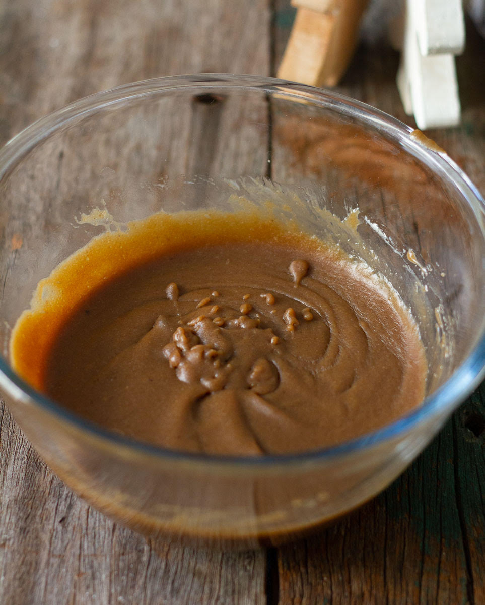 Wet ingredients for crinkle cookies in a mixing bowl.