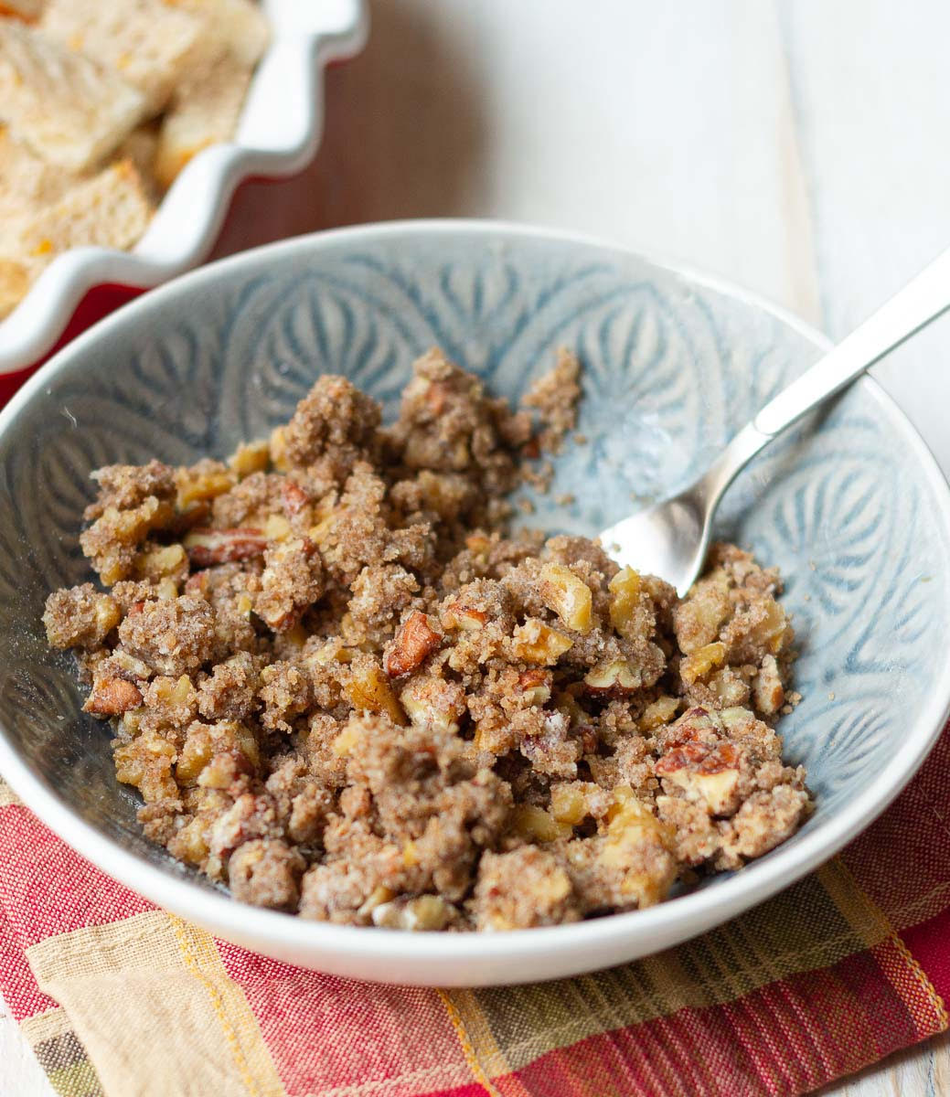 Crumble topping in a bowl with a fork.