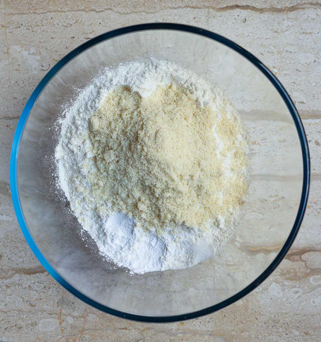 Flour and almond flour in a mixing bowl.
