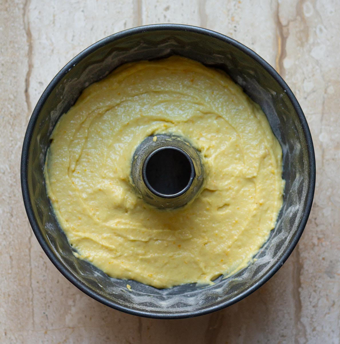 Cake batter in a bundt pan.