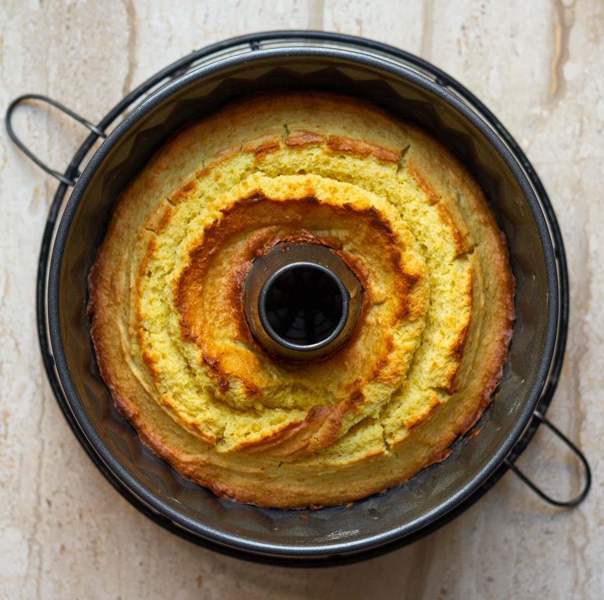 Baked whole orange cake in a bundt pan.