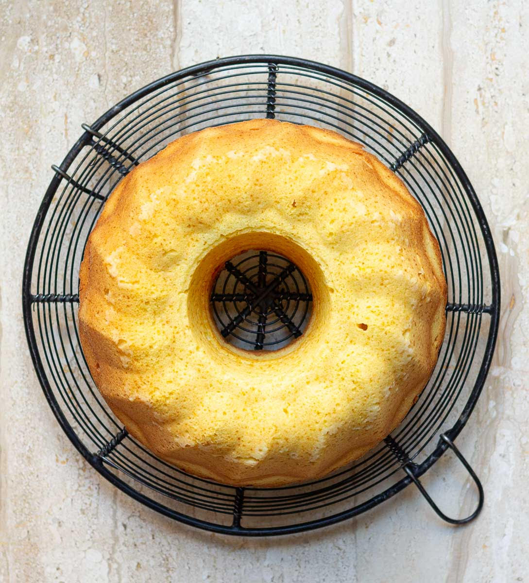 Cake on a round cooling rack.