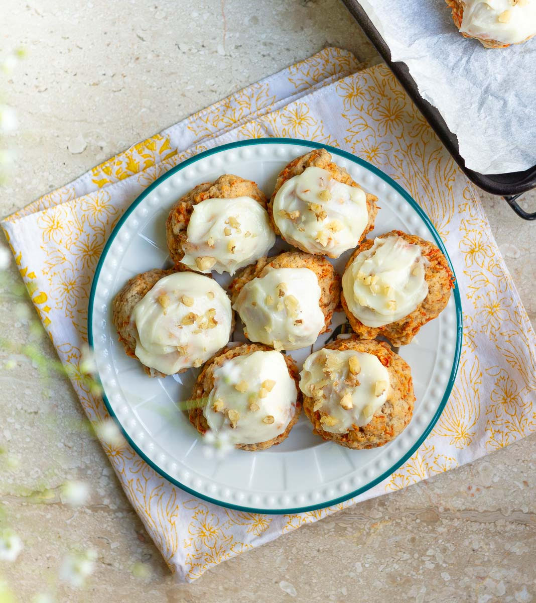 Carrot Cake Cookies with Cream Cheese Frosting on a serving plate.