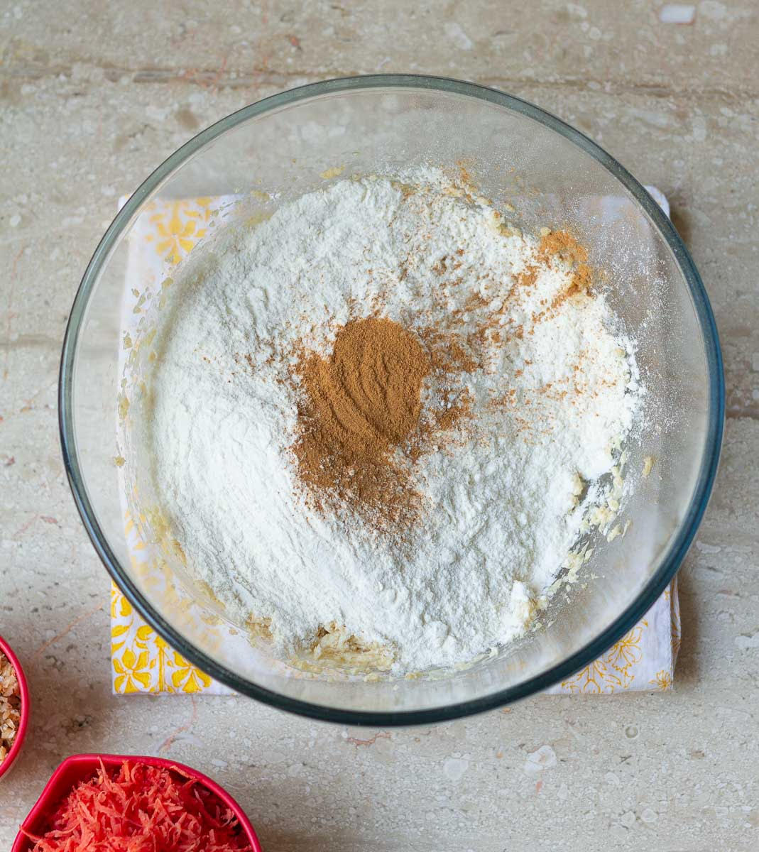 Flour, baking soda, and cinnamon powder added to the butter mixture.