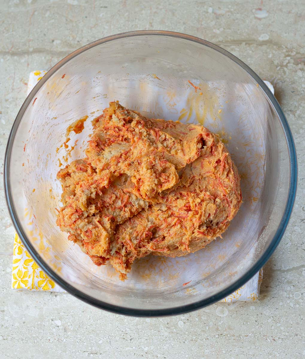 Ready carrot cookie dough in a bowl.