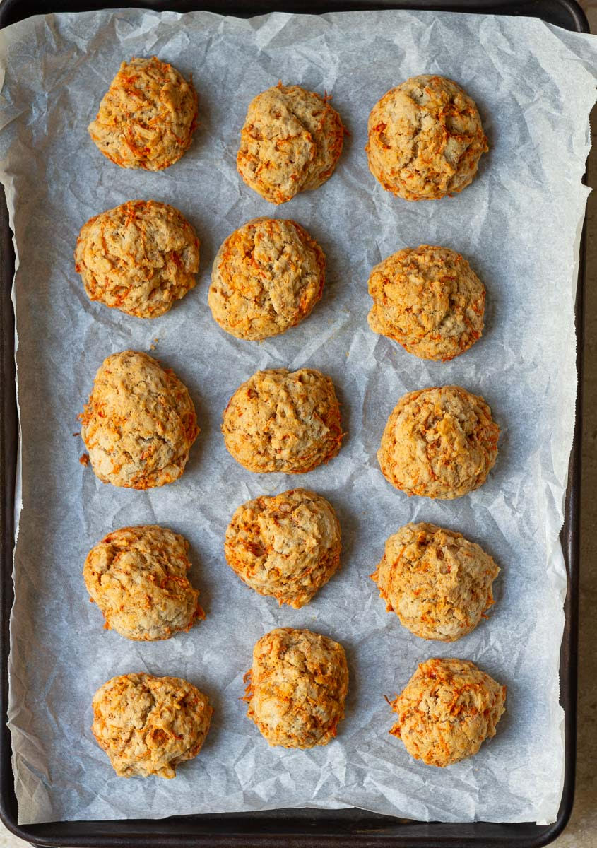 Baked carrot cookies on a baking tray.
