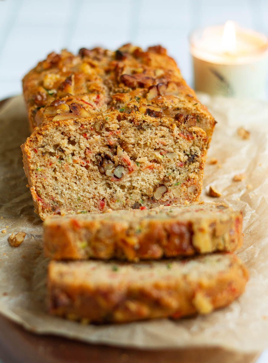Sliced Carrot Zucchini Bread on parchment paper.