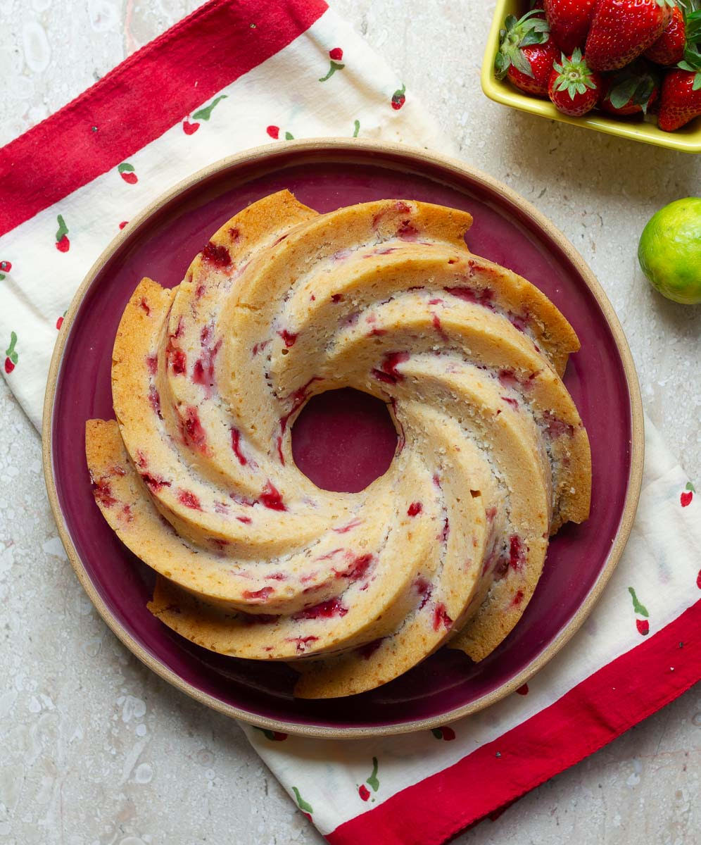 Strawberry Bundt Cake on a red serving platter.