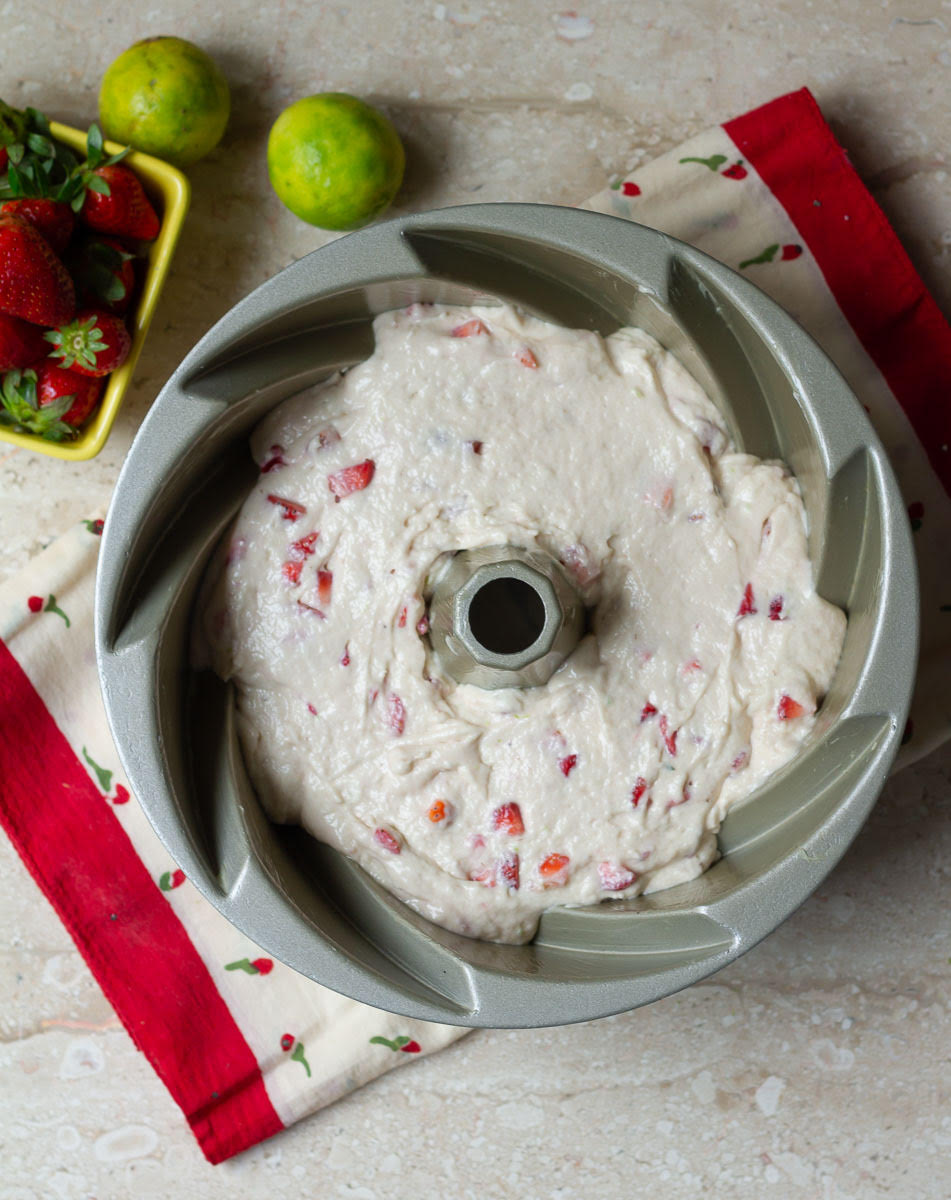 cake batter in a greased bundt cake pan.