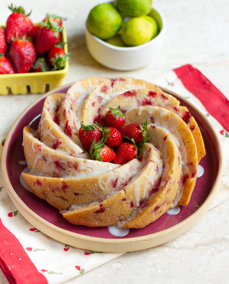 Strawberry cake with lemon glaze and fresh strawberries in the center.