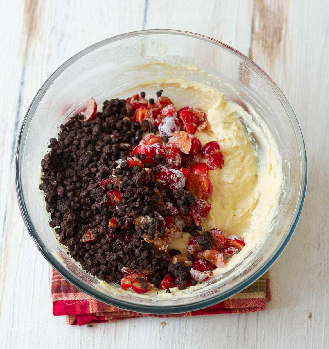 Cherries and chocolate chips on the cake batter.