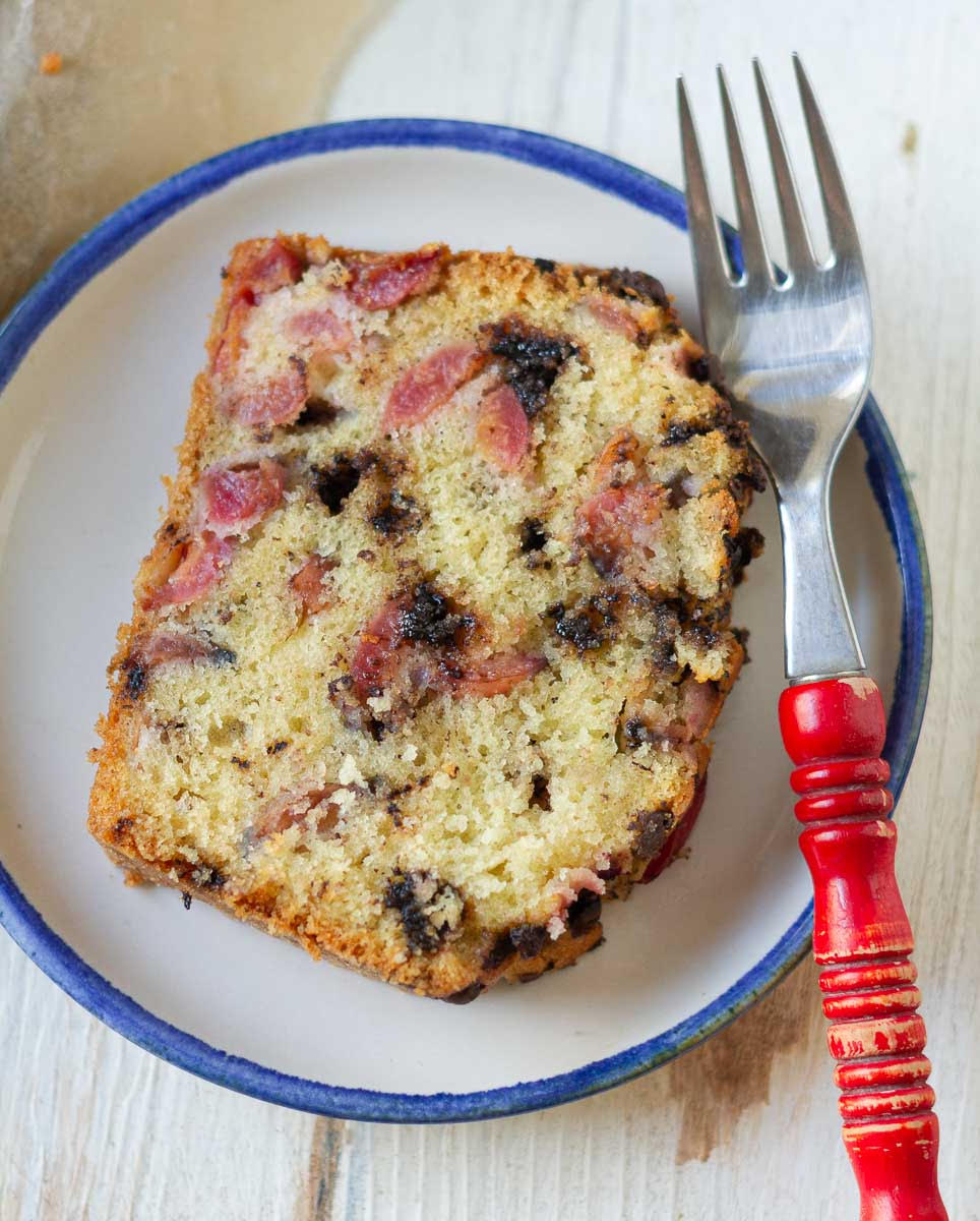 slice of Cherry Chocolate Chip Cake on a plate