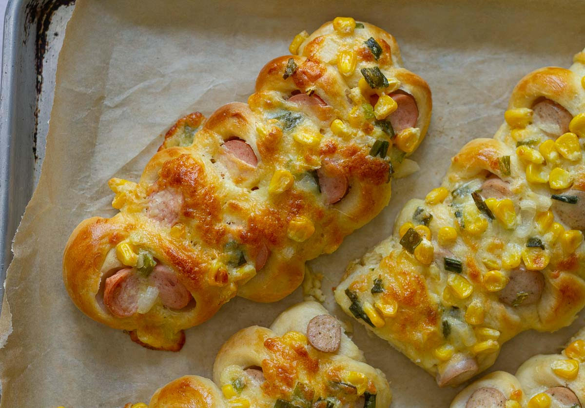 Baked Korean Sausage Bread on parchment paper.