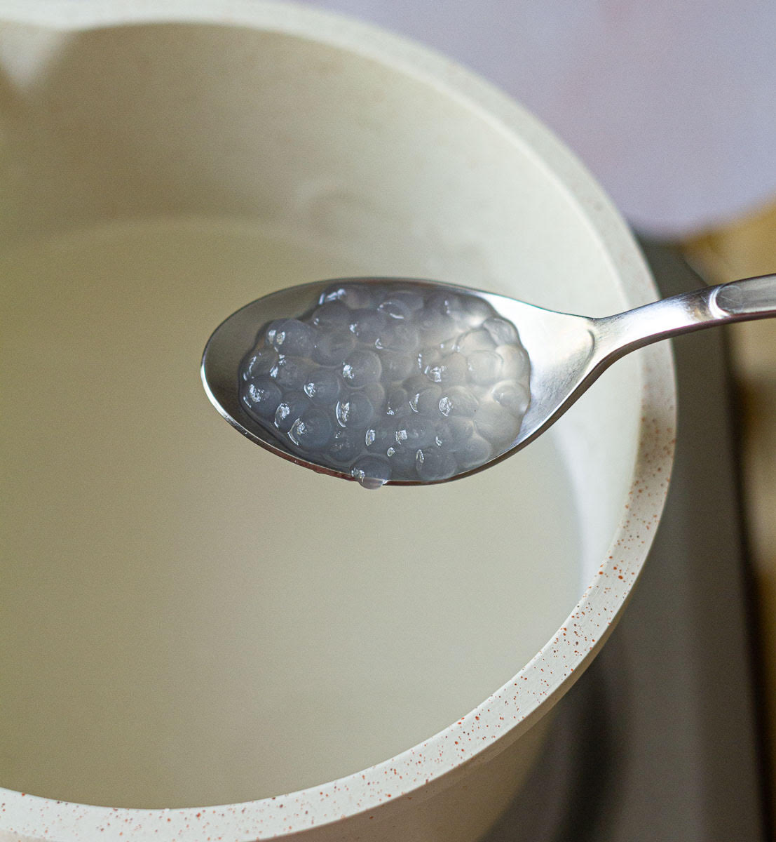 A spoonful of cooked sago or tapioca pearls.