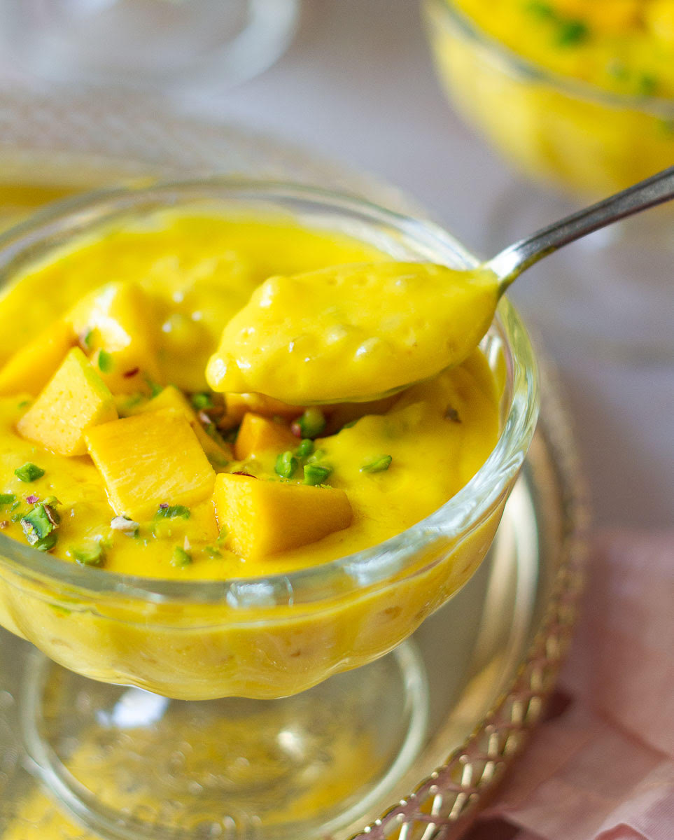 A spoonful of mango sago to show the creamy texture.