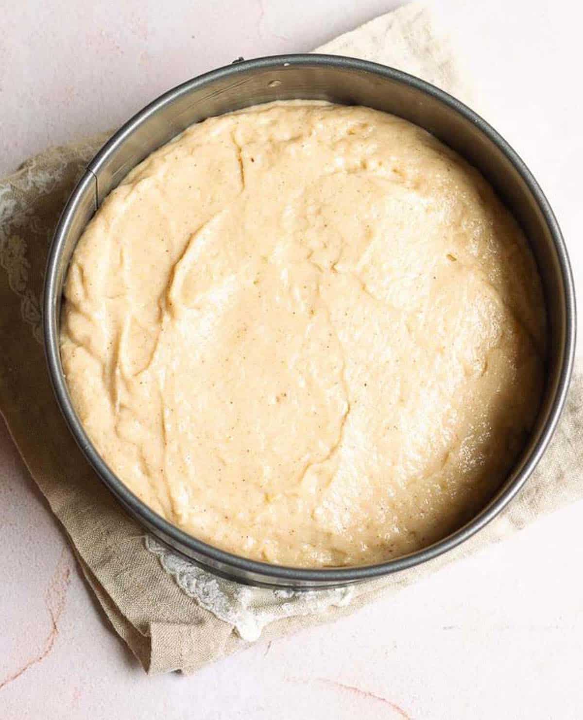 Cake batter in a cake tin.
