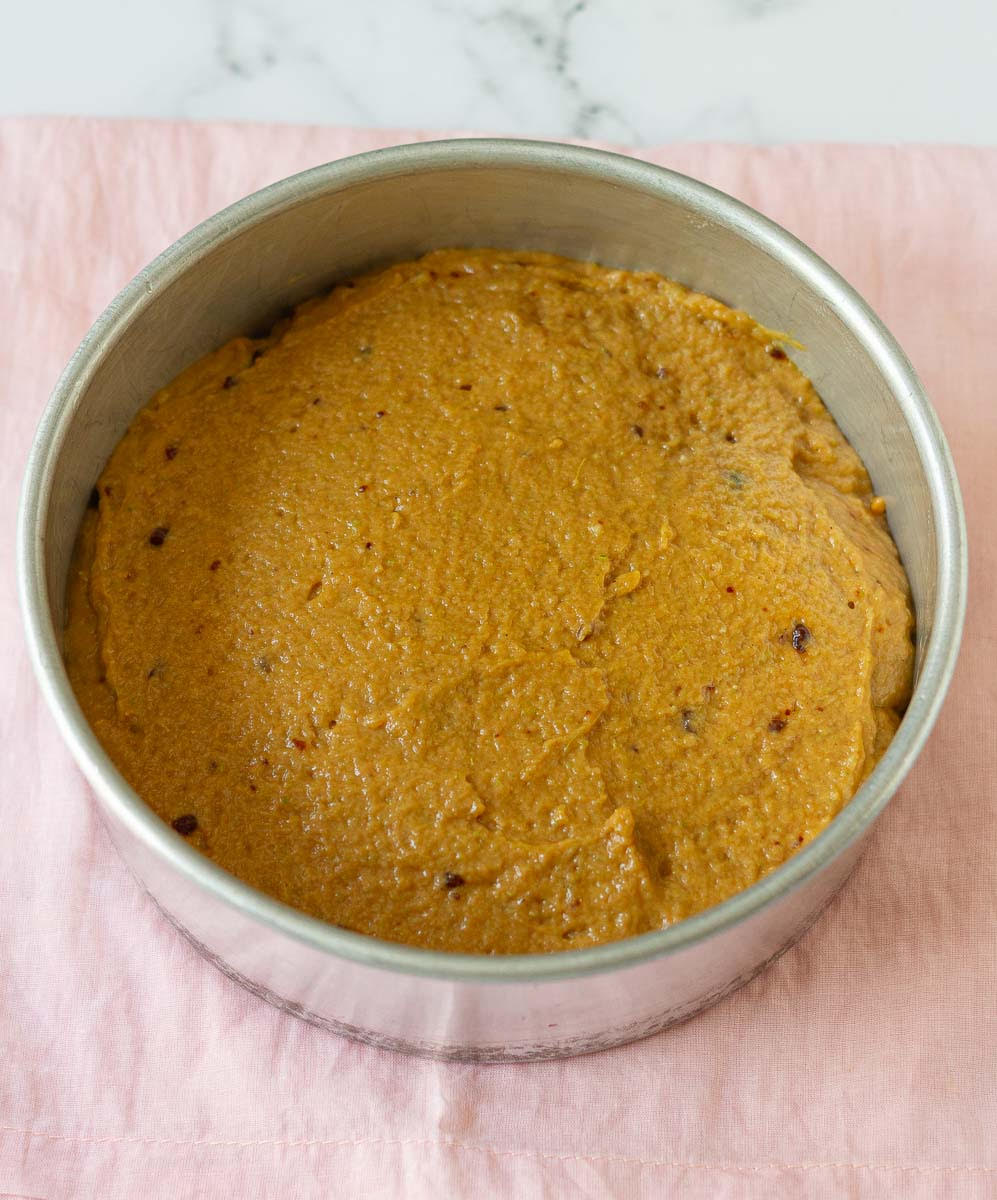 Cardamom Almond Tea Cake batter in a round cake pan.