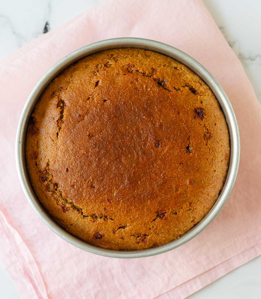 Baked Cardamom Almond Tea Cake in a round cake pan.
