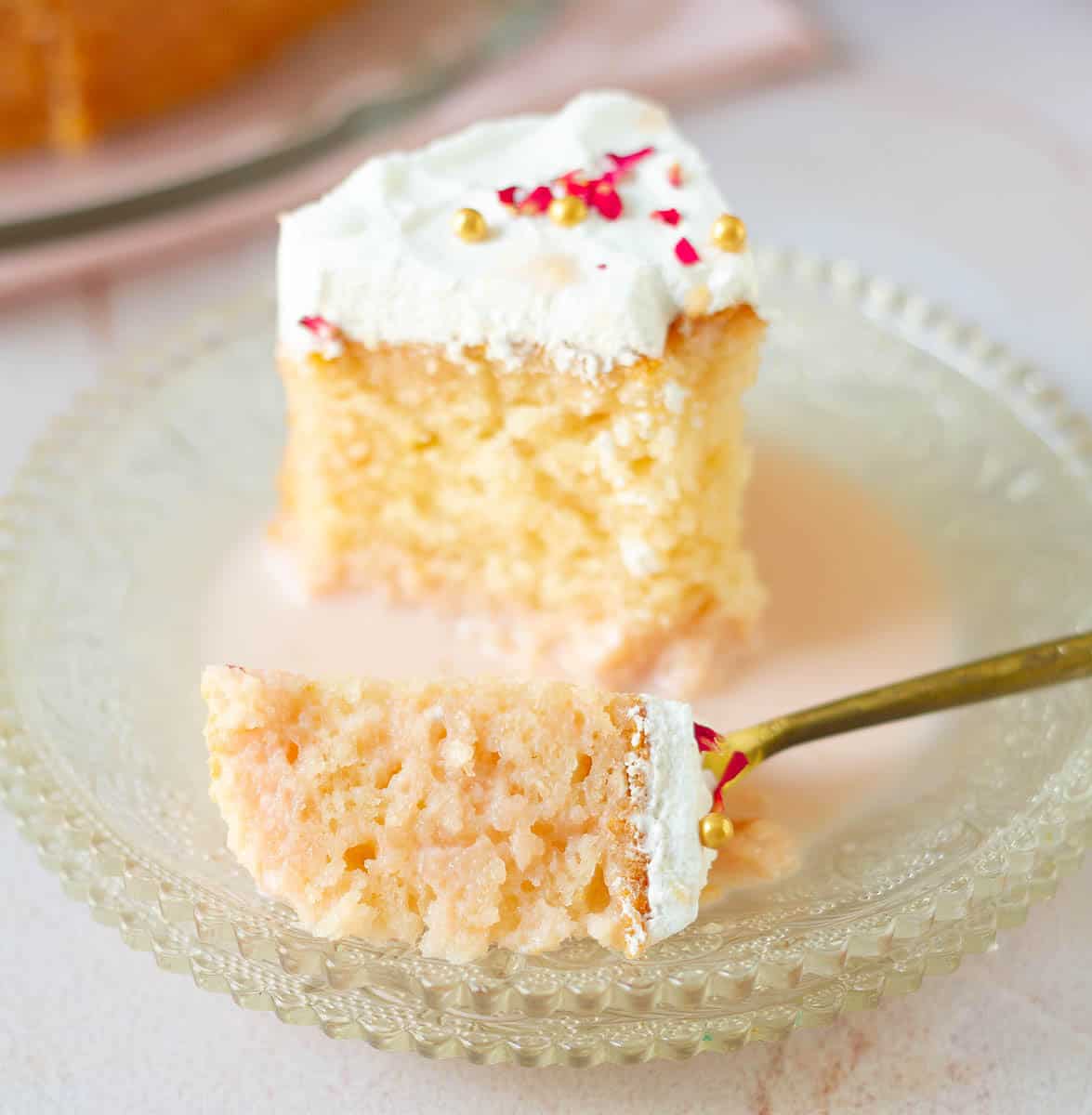 A bite of cake on a fork.