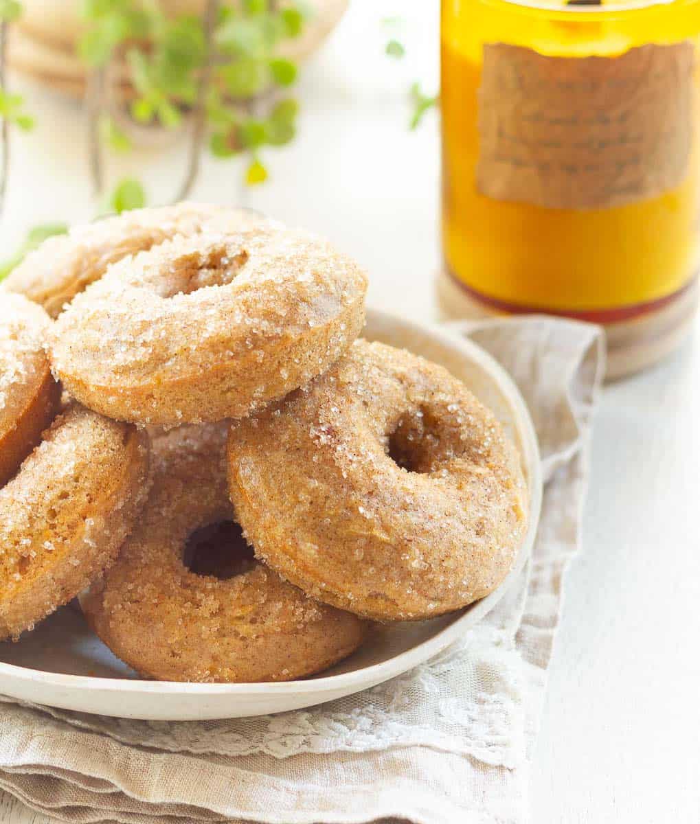 Baked Apple Donuts with Cinnamon Sugar on a plate.