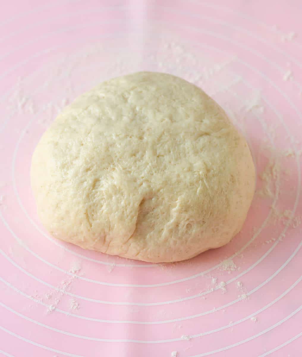 Dough for the flatbread on a silicone mat.