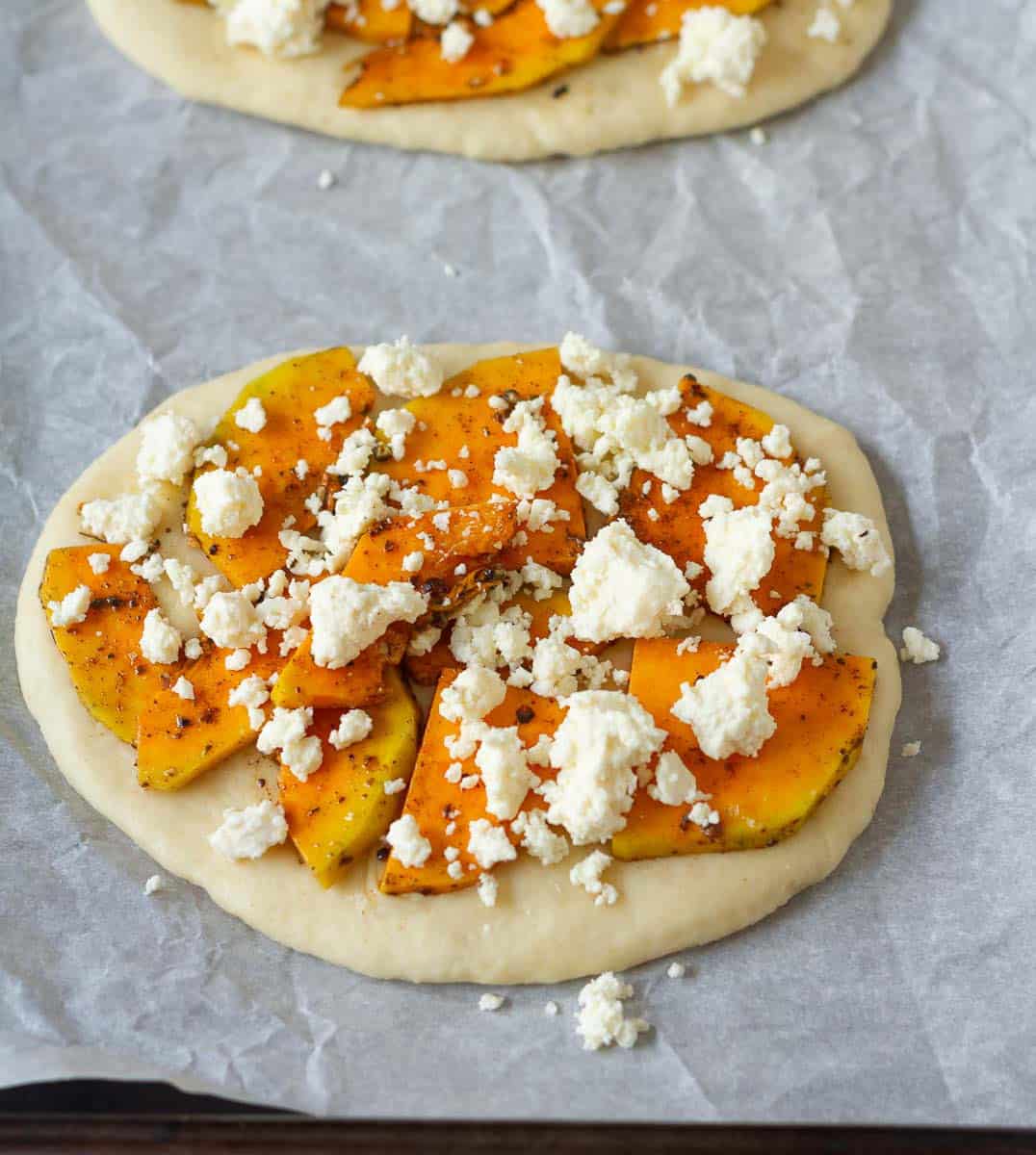 seasoned butternut squash and feta on top of the rolled out dough.