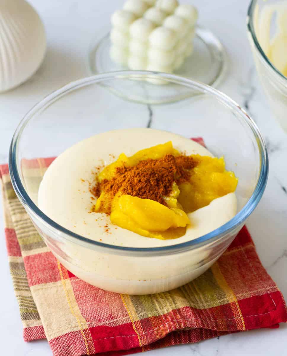 Mix in the pumpkin puree and pumpkin pie spice into the plain batter