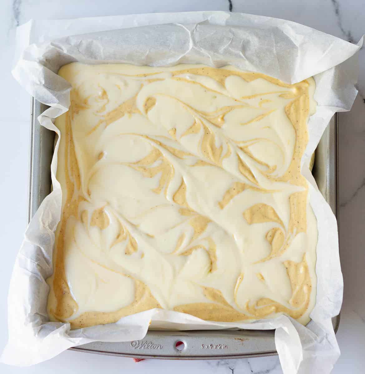 Pumpkin Swirl Cheesecake Bars ready for baking