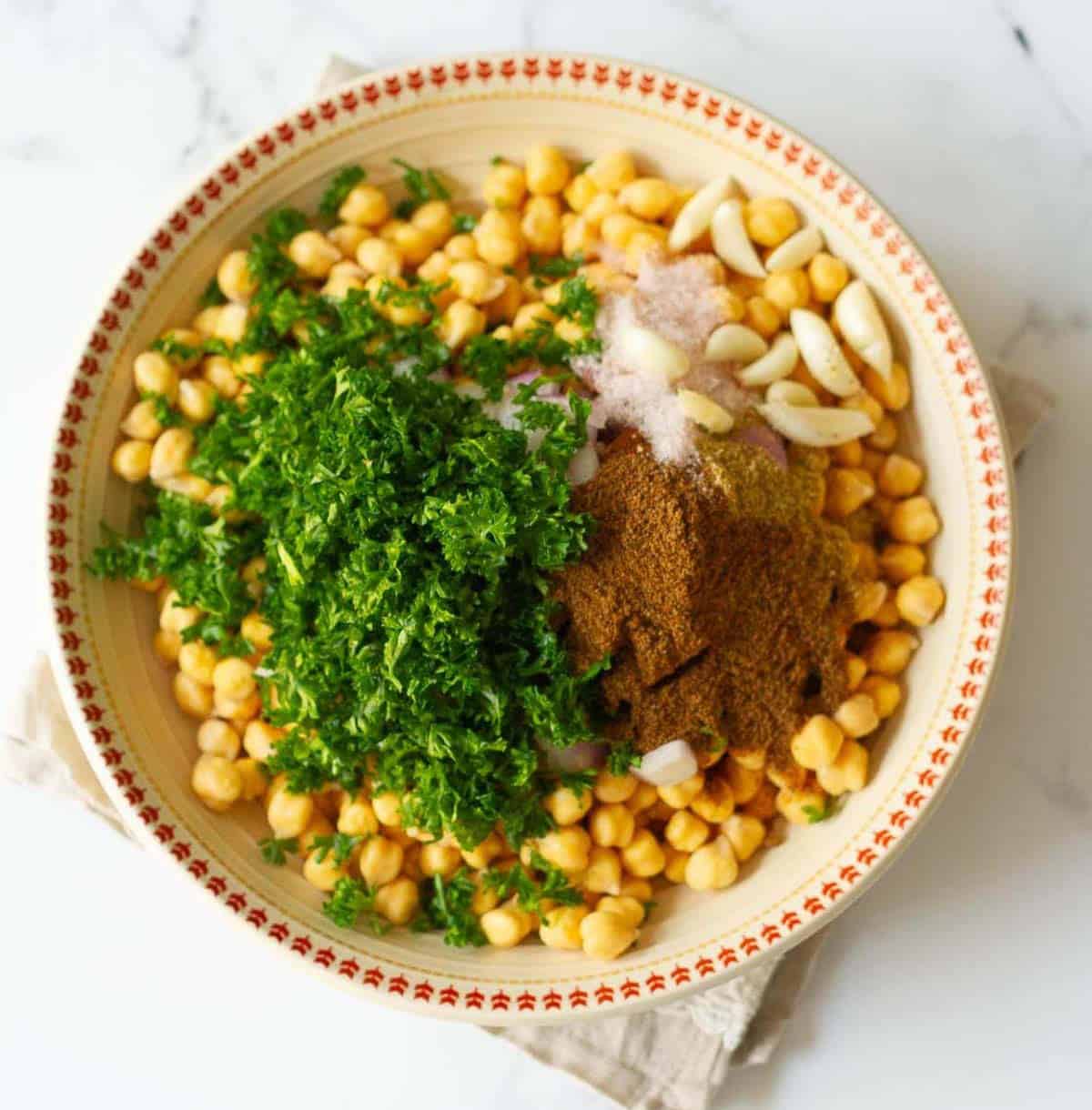 ingredients for making falafels in a bowl.