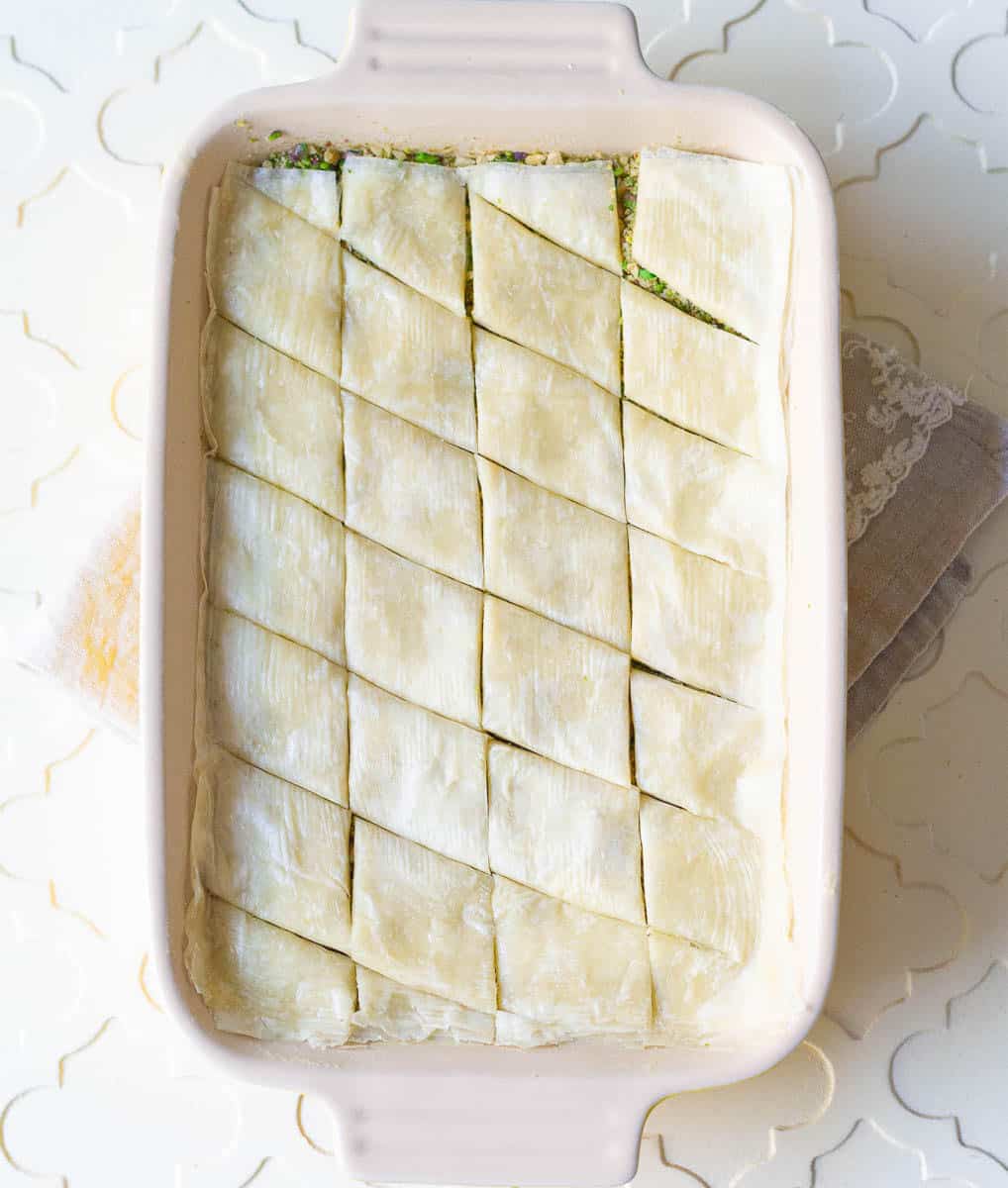 Cut the phyllo layers into diamonds