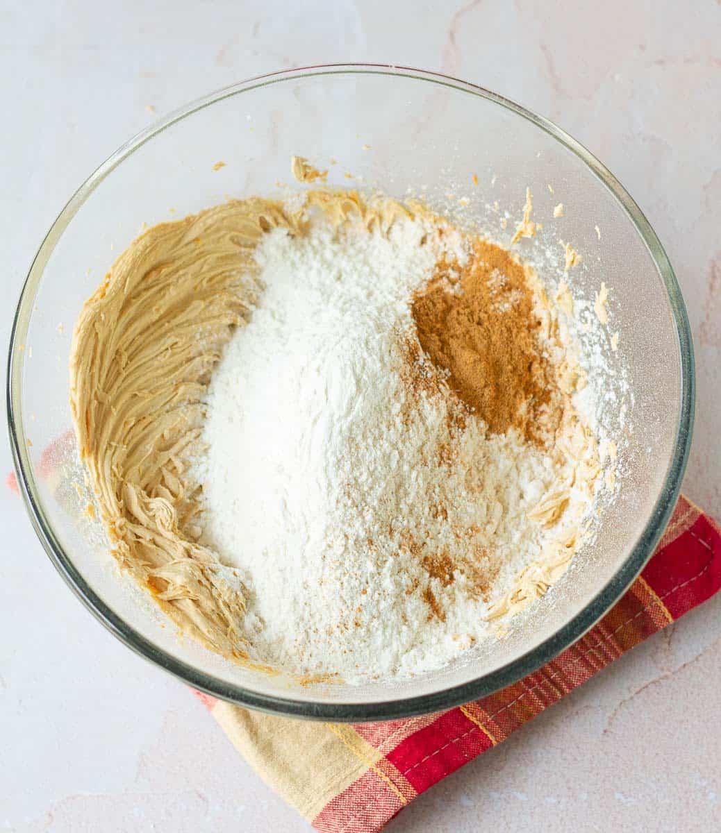 Add flour and cinnamon powder to the butter -sugar mixture