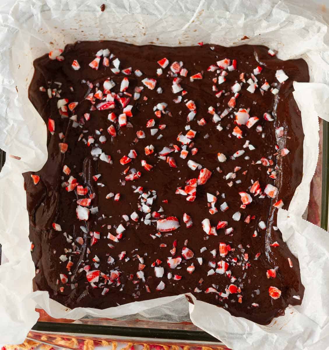 Fudge mixture in parchment lined pan.